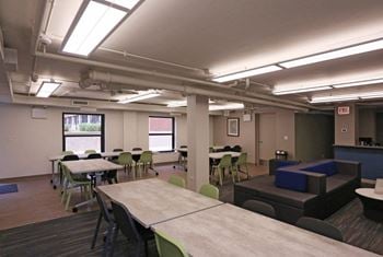 Community room with long table and windows